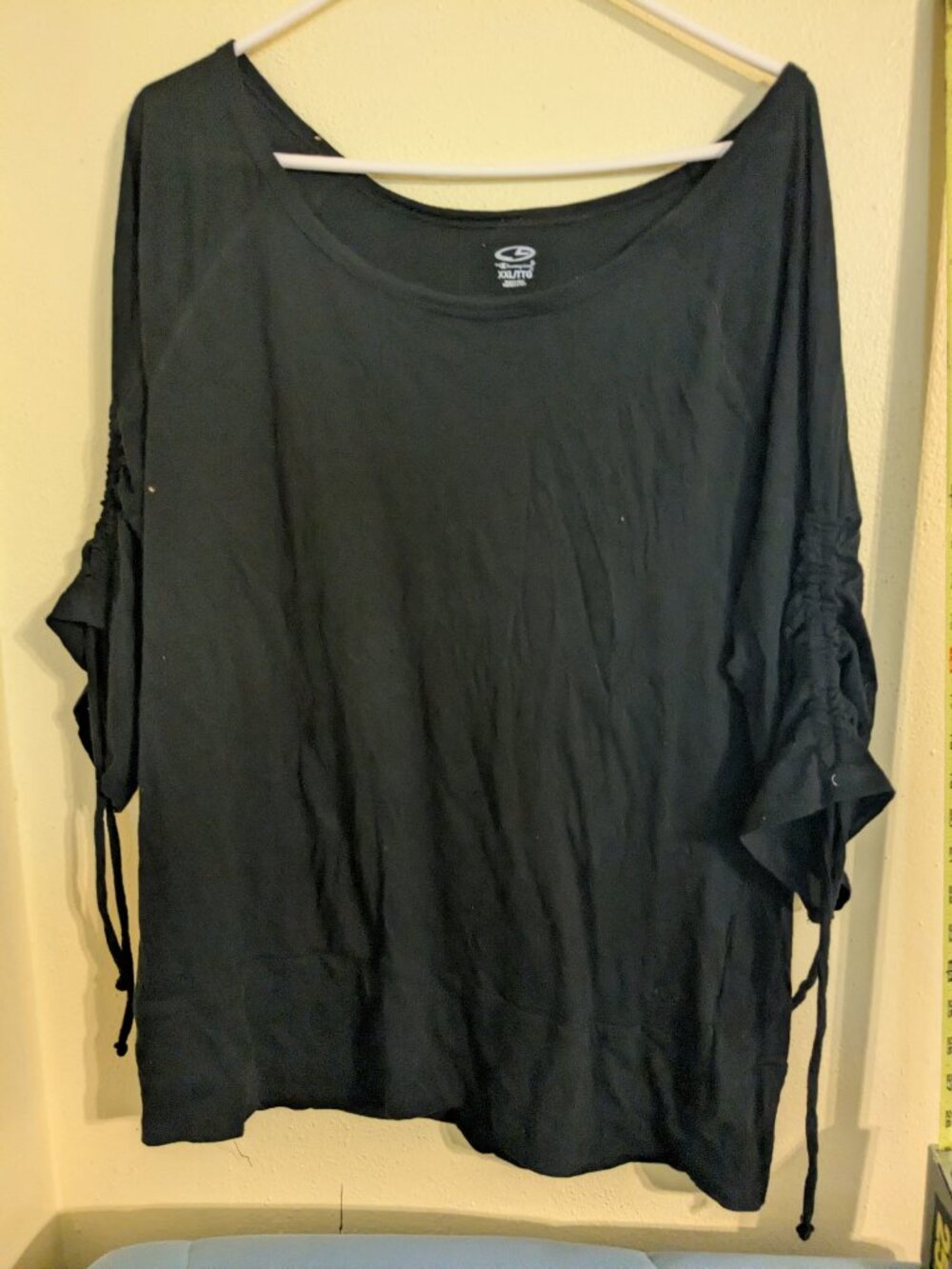 Black shirt with drawstring sleeves.